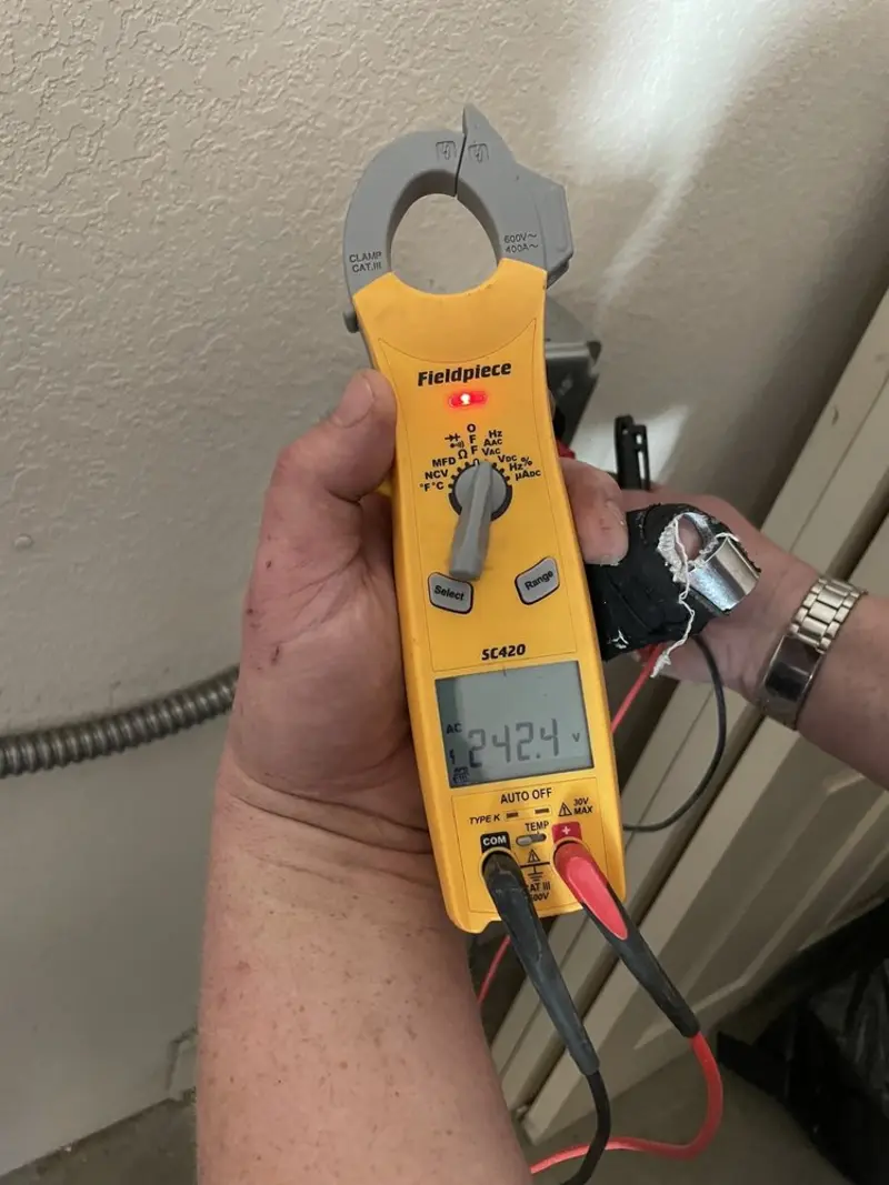 Voltage testing with clamp meter during Ceiling Fan Installation in Melrose Park